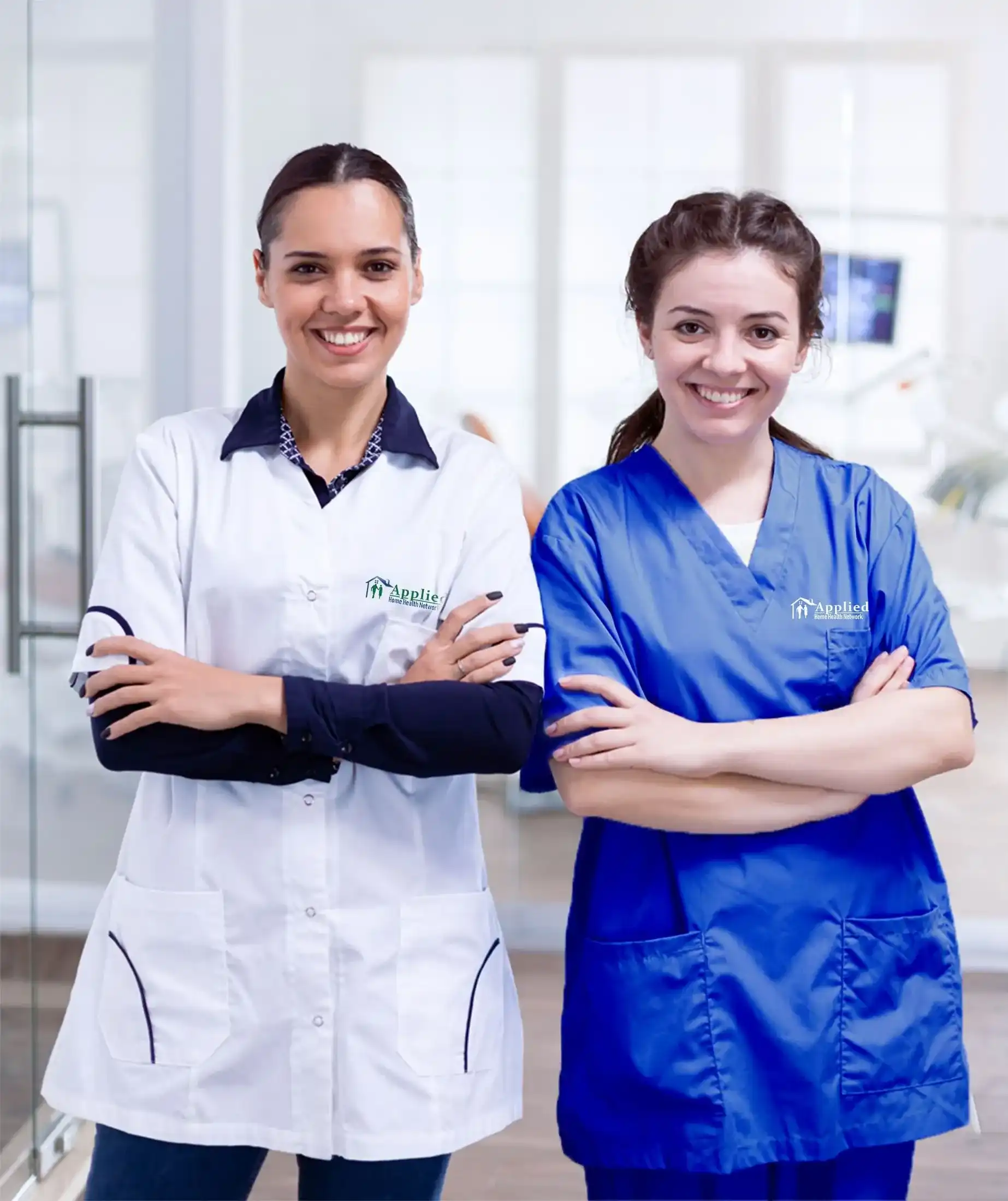 two hhn nurses smilling in the camera