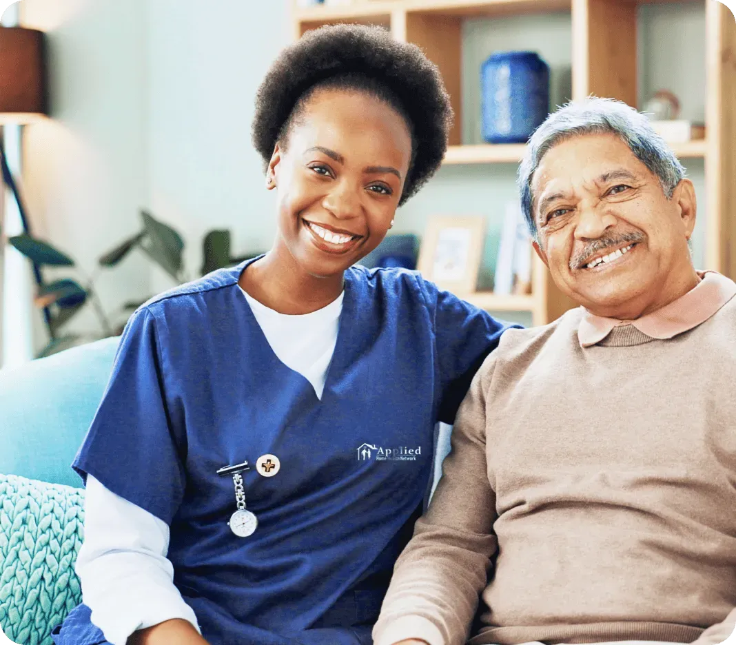 A caring nurse interacts with an elderly man in a nursing home, highlighting the importance of support and companionship