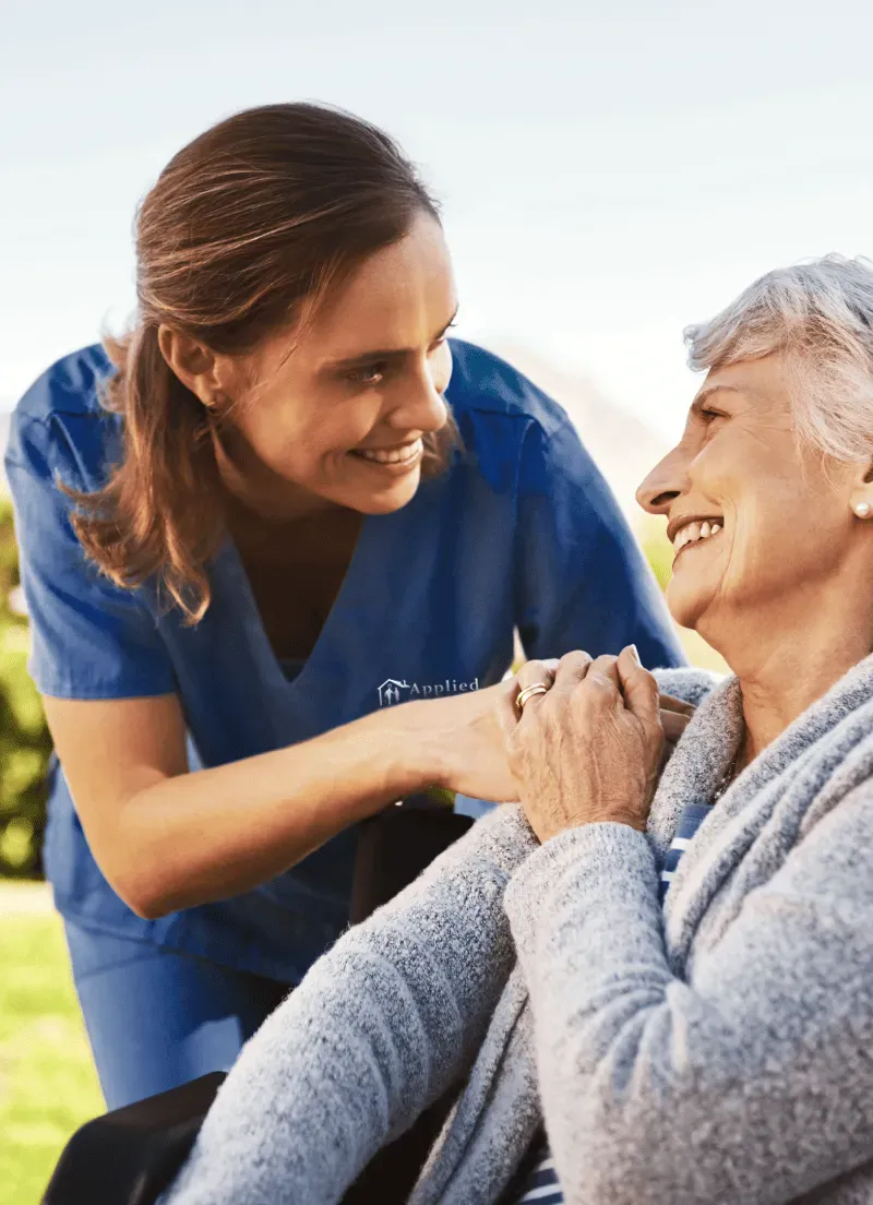 Nurse showing compassion to an elderly woman