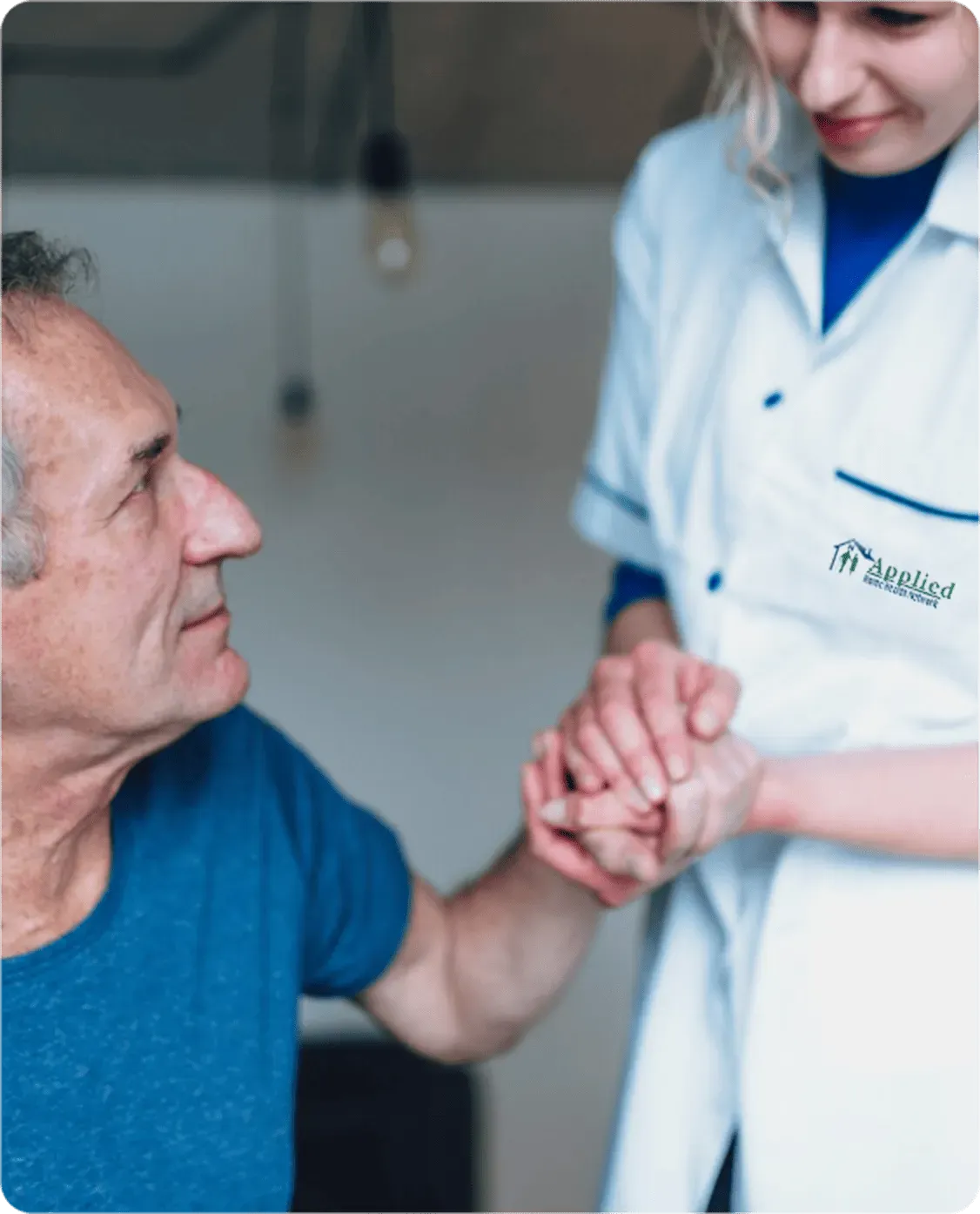 nurse caring for a happy elderly woman