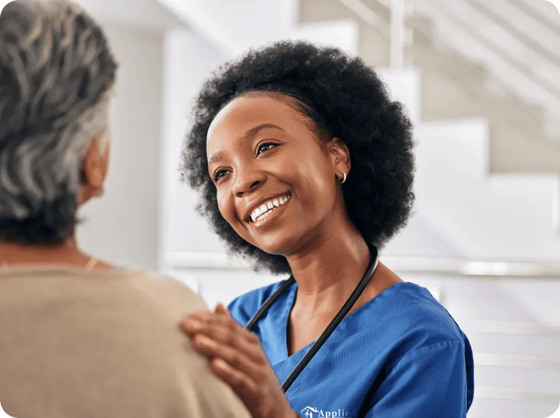 happy nurse assisting an elderly woman